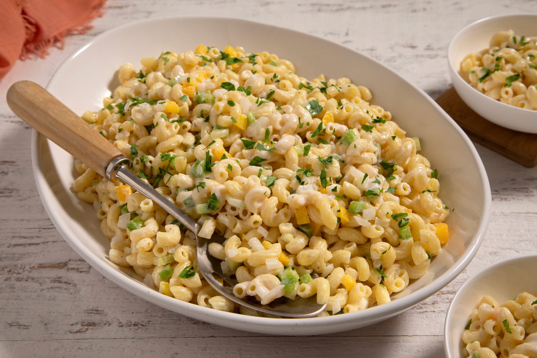 Creamy Macaroni Salad styled and served in bowls