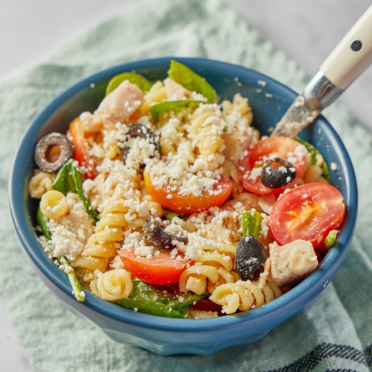 Chicken pasta salad can be a light, healthy lunch in its own right, not just a side dish. This one is especially healthy, thanks to its use of whole wheat pasta and especially its hummus-based dressing.