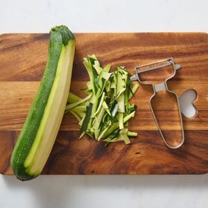 Peeled Zucchini On A Chopping Board